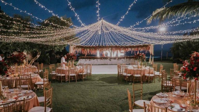 sparkling fairy light canopy over wedding reception in a beautiful outdoor area