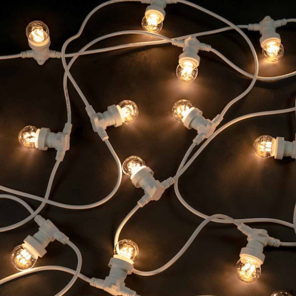 beautiful white festoon lights on black background