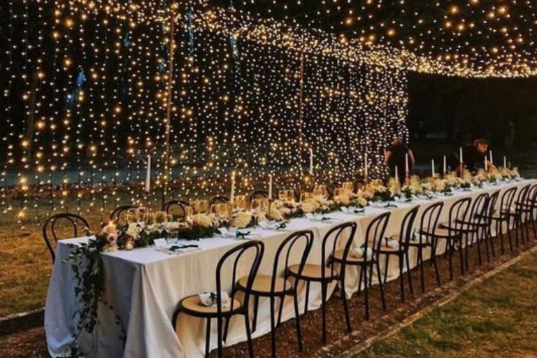 Pretty festoon lights illuminating a party.