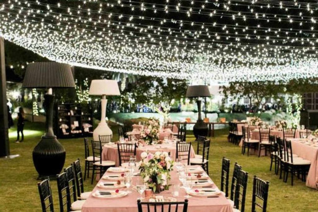 sparkling fairy lights creating a glistening ceiling at a wedding reception