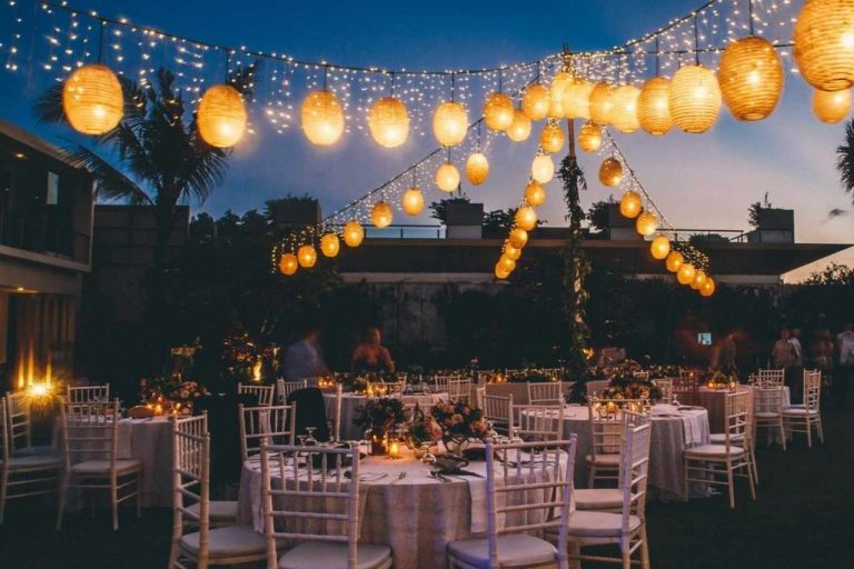 Pretty festoon lights illuminating a party.