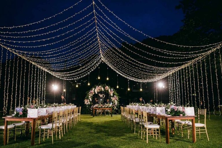 Stunning party festoon lights illuminating a wedding.