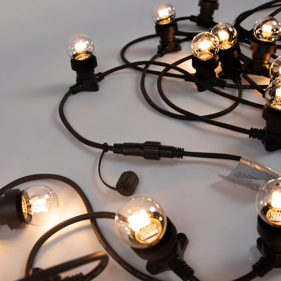 Black Festoon Lights shining bright with 10 bulbs per 10m and black cable on white background